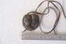 Clay Pendant With Aboriginal Heads Showing  001